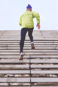 man running up the stairs