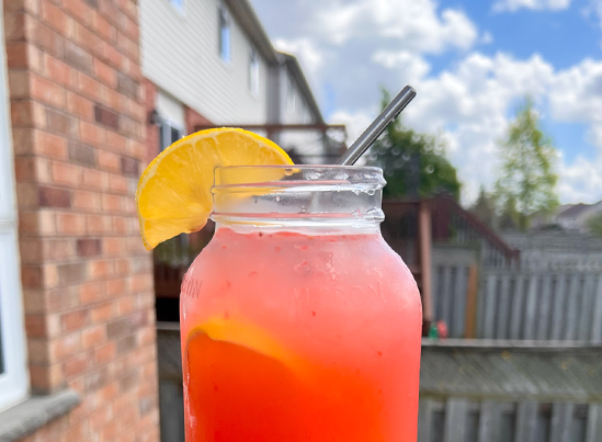 Frozen Raspberry Lemonade Mocktail in a mason jar glass