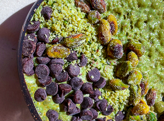 Green matcha chip smoothie bowl with toppings