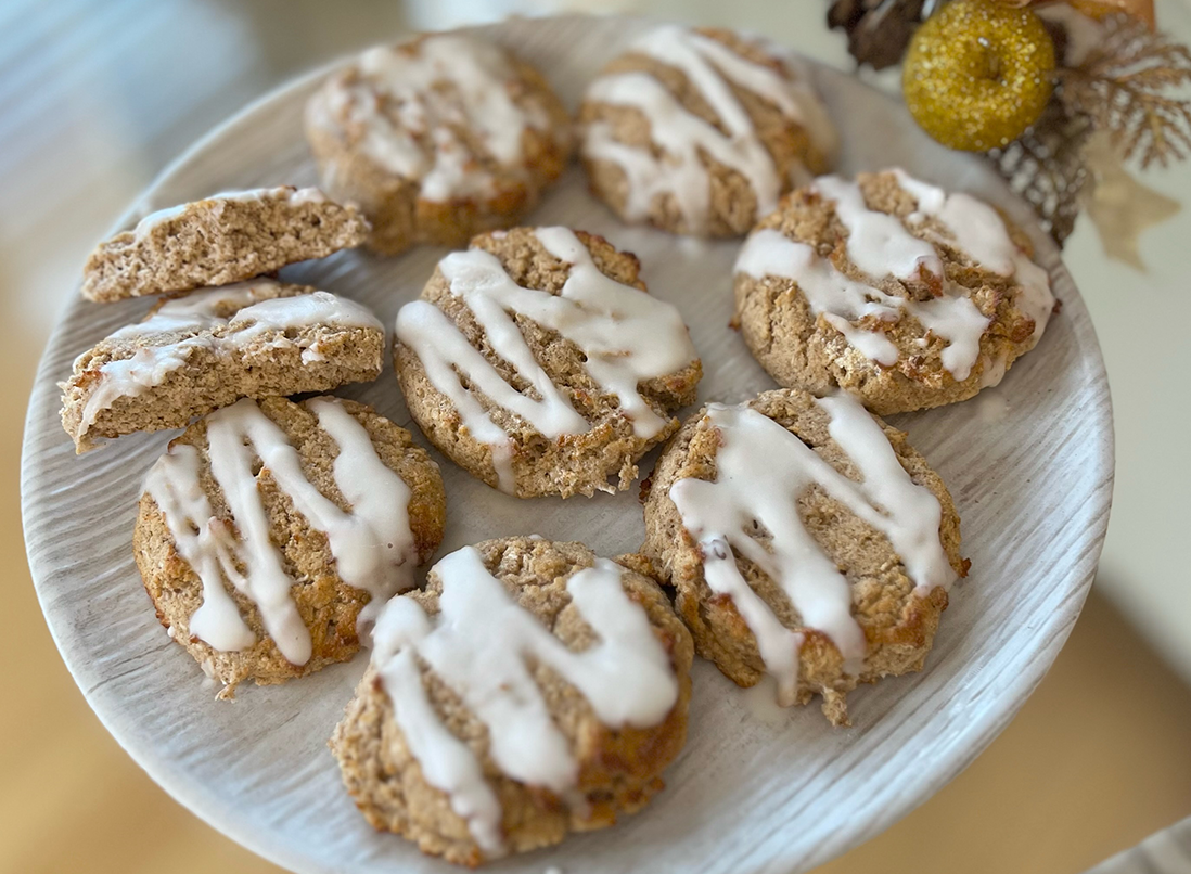 Gingerbread spiced coconut biscuits with Myo-Inositol glaze on a white plate