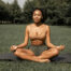 woman meditating in a park
