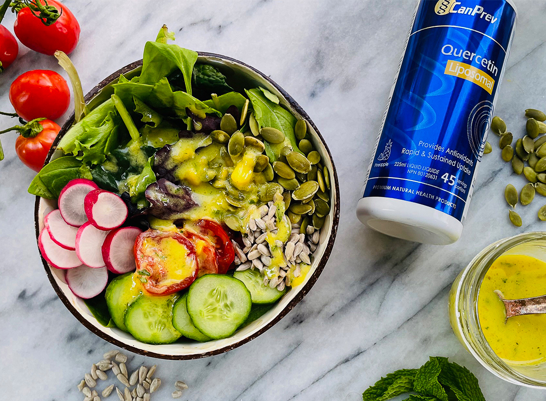 colourful tropical salad bowl with vibrant liposomal quercetin dressing