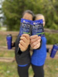 CanPrev ElectroMag sachets help up by two women in fitness clothing 