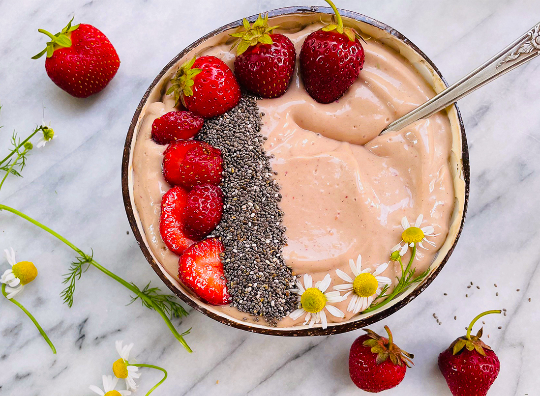 Summer Glow Berry Smoothie Bowl with fresh strawberries, chia seeds and chamomile flowers