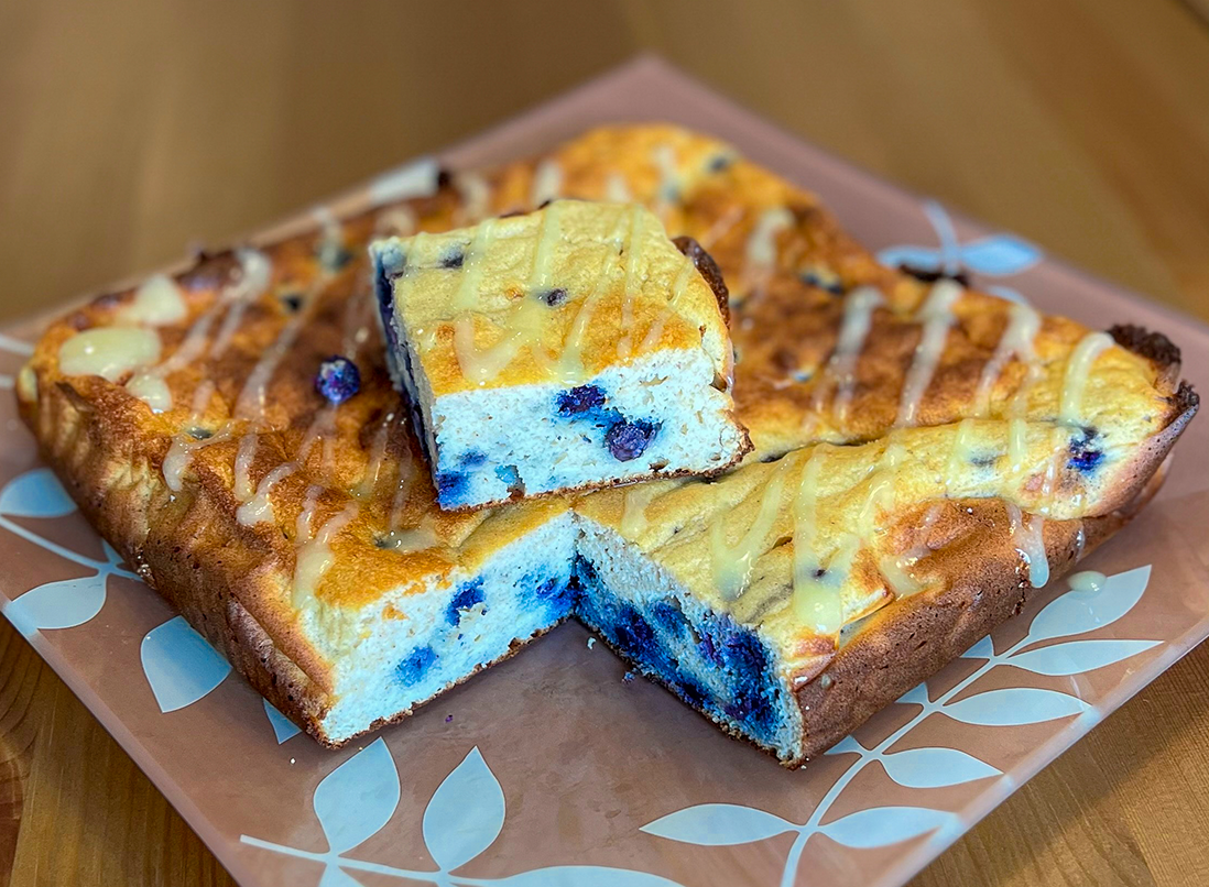 Blueberry Breakfast Squares on a plate with Liposomal GABA drizzle