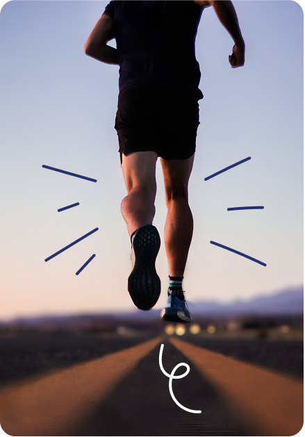Back view of a runner sprinting along a straight road at sunset, wearing black shorts and blue sneakers; motion lines emphasize speed.