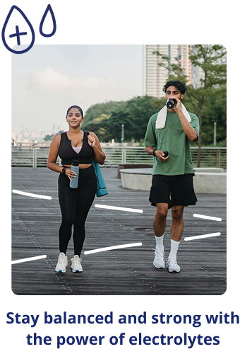 Two runners on a boardwalk holding water bottles; caption promotes staying balanced and strong with electrolytes.