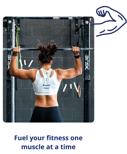 Back view of a woman in a white sports bra lifting a barbell on a squat rack in a gym environment.